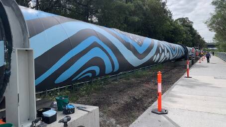 A graffiti-covered 800-metre pipeline at Tempe that carries millions of litres of drinking water from the Sydney Desalination Plant every day is being given a major face lift thanks to a First Nations-inspired artwork project. Picture supplied